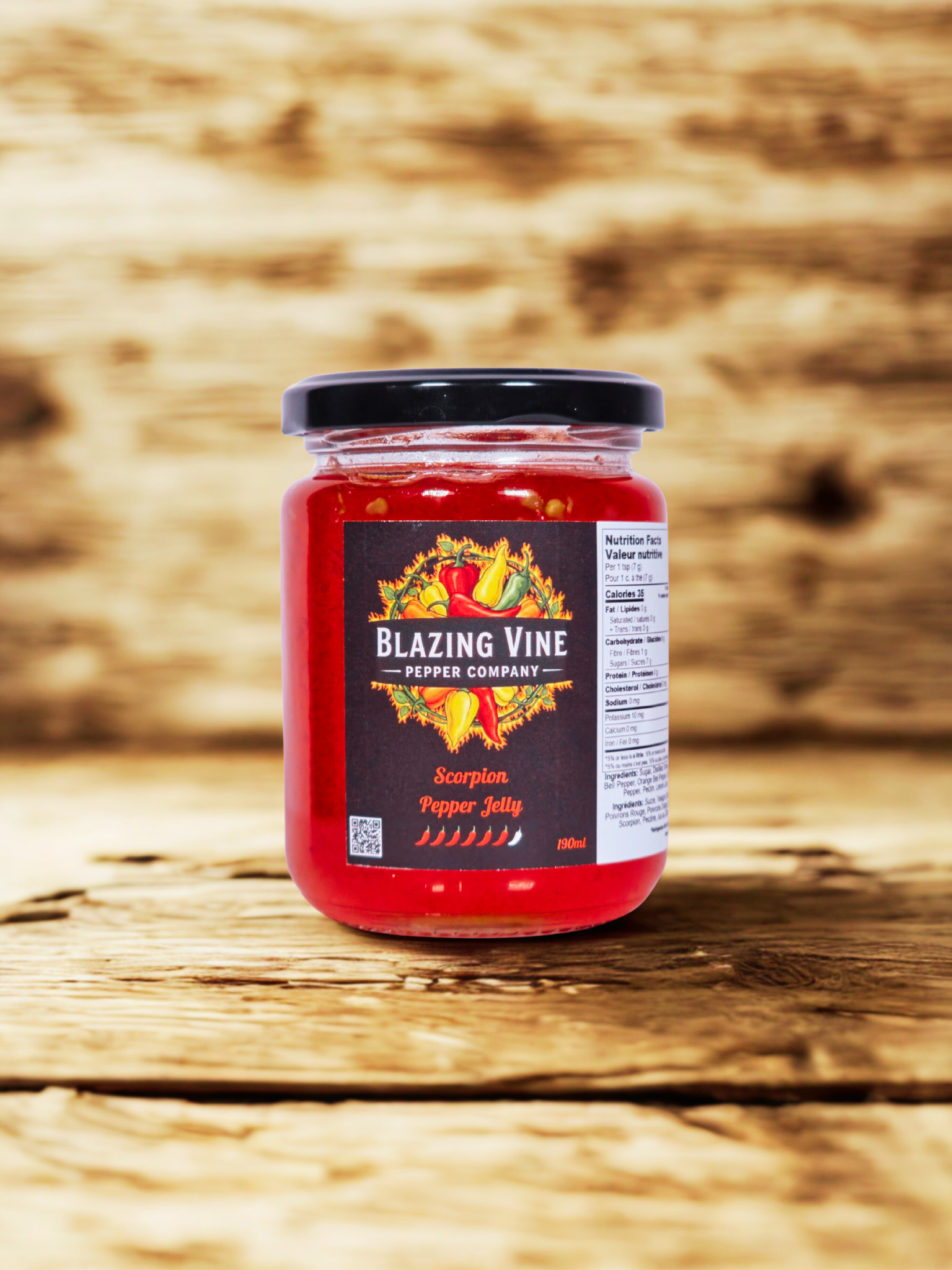 Blazing Vine Scorpion — deep red jelly in a glass jar on rustic wood